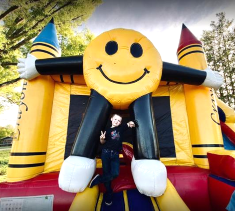 Smiley Face Bounce house with water slide 